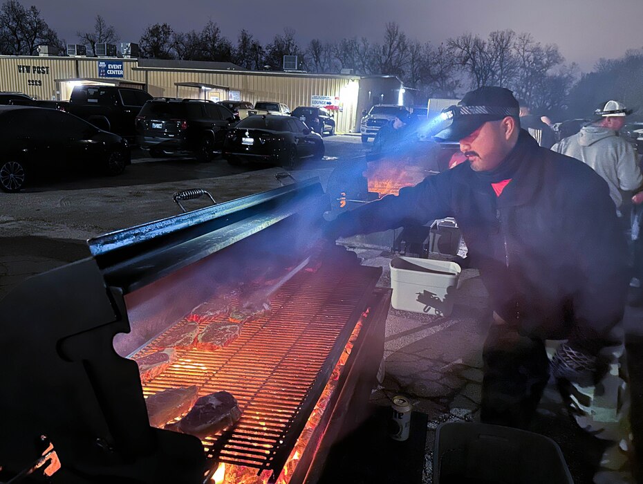 Man grilling steaks