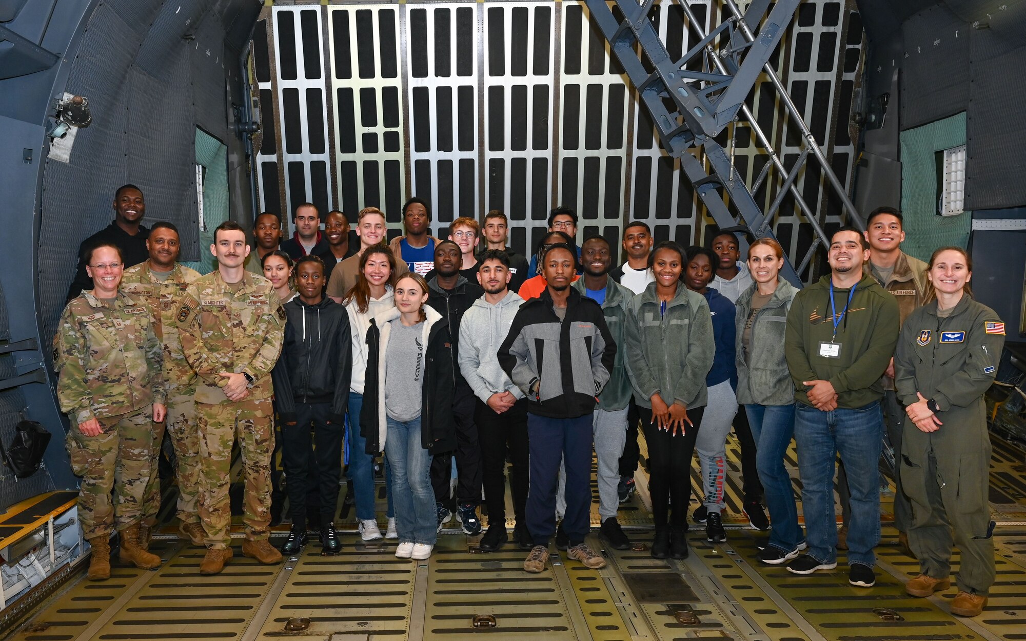Airmen from the 709th Airlift Squadron and the 512th Development and Training Flight pose for a photo inside a C-5M Super Galaxy aircraft on Dover Air Force Base, Delaware, Dec. 2, 2023. The 512th DTF is a delayed entry program that assists newly-enlisted trainees with acclimating to the Reserve and cultivating basic skills of an Airman prior to attending Basic Military Training. 
(U.S. Air Force photo by Senior Airman Shayna Hodge)