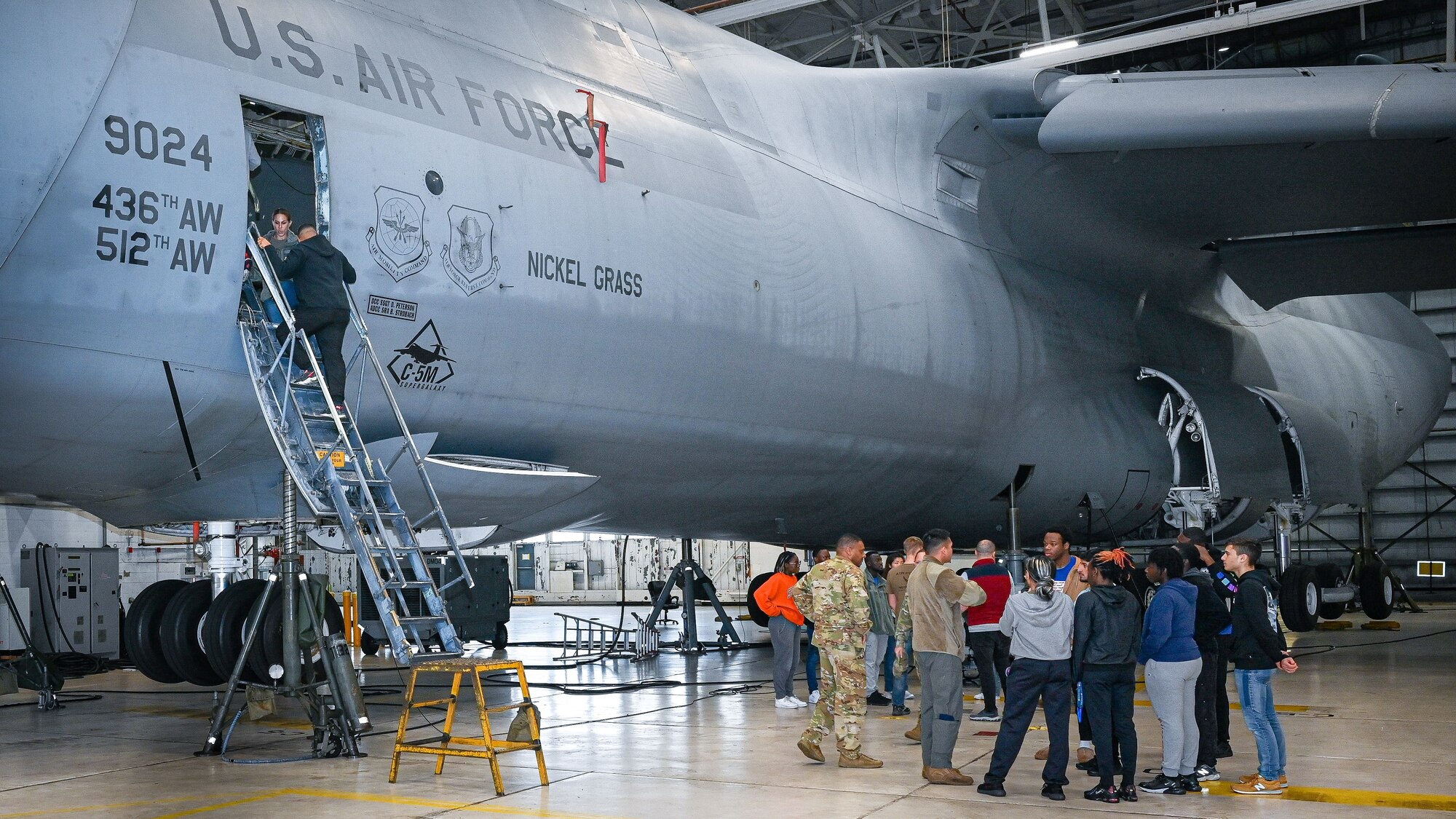 Airmen from the 709th Airlift Squadron speak to members of the 512th Development and Training Flight on Dover Air Force Base, Delaware, Dec. 2, 2023. The 709th AS educated the DTF about the C-5M Super Galaxy and their responsibilities on the aircraft. (U.S. Air Force photo by Senior Airman Shayna Hodge).