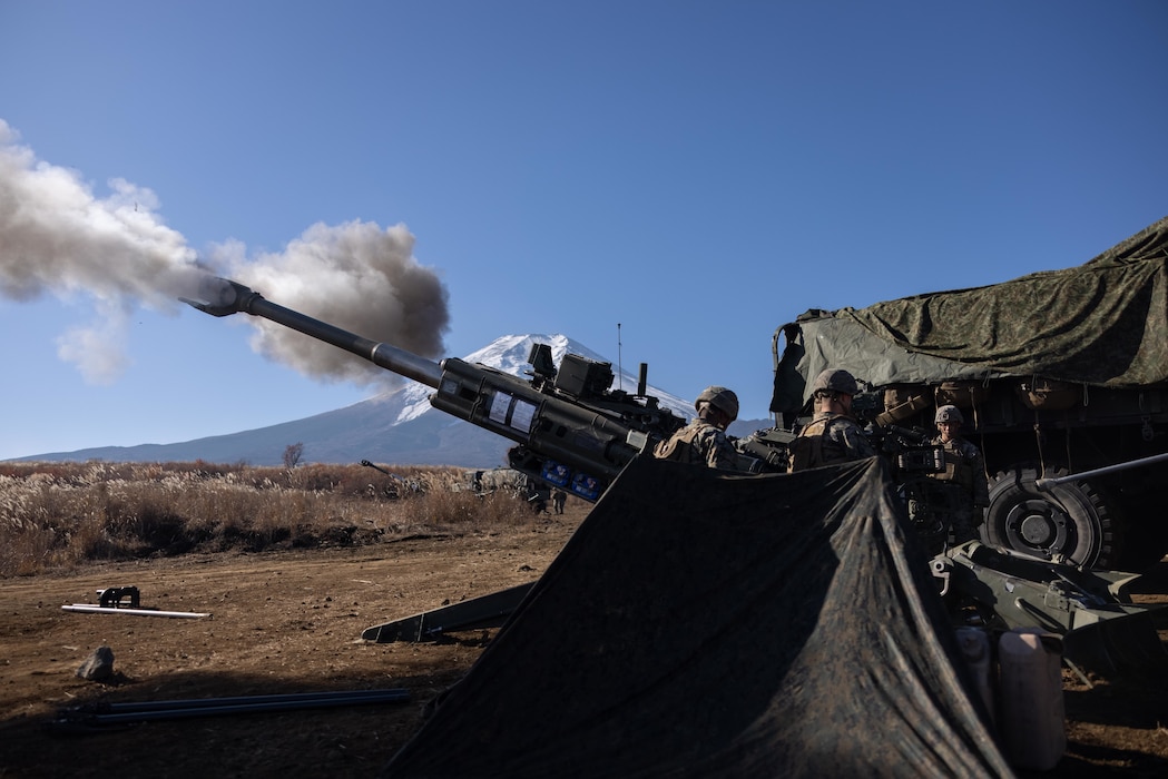 U.S. Marines fire an M777 Howitzer during Artillery Relocation Training Program 23.3 in the North Fuji Maneuver Area at Combined Arms Training Center Camp Fuji, Japan, Nov. 24, 2023. The skills developed at ARTP increase the proficiency and readiness of the only permanently forward-deployed artillery unit in the Marine Corps, enabling them to provide indirect fires. The Marines are with Alpha Battery, 3d Battalion, 12th Marine Littoral Regiment, 3d Marine Division. (U.S. Marine Corps photo by Sgt. Alyssa Chuluda)