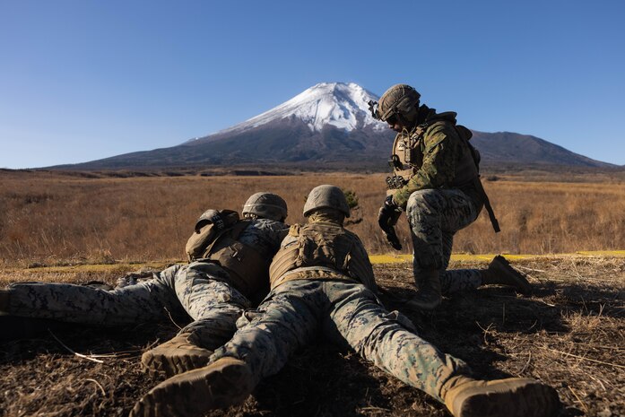 U.S. Marines fire an M240B machine gun during Artillery Relocation Training Program 23.3 in the North Fuji Maneuver Area at Combined Arms Training Center Camp Fuji, Japan, Nov. 29, 2023. The skills developed at ARTP increase the proficiency and readiness of the only permanently forward-deployed artillery unit in the Marine Corps, enabling them to provide indirect fires. The Marines are with Alpha Battery, 3d Battalion, 12th Marine Littoral Regiment, 3d Marine Division. (U.S. Marine Corps photo by Sgt. Alyssa Chuluda)