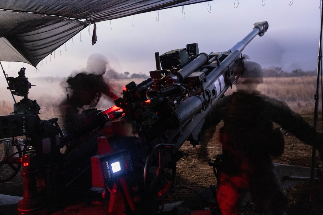 U.S. Marines prepare to fire an M777 Howitzer during Artillery Relocation Training Program 23.3 in the North Fuji Maneuver Area at Combined Arms Training Center Camp Fuji, Japan, Nov. 26, 2023. The skills developed at ARTP increase the proficiency and readiness of the only permanently forward-deployed artillery unit in the Marine Corps, enabling them to provide indirect fires. The Marines are with Alpha Battery, 3d Battalion, 12th Marine Littoral Regiment, 3d Marine Division. (U.S. Marine Corps photo by Sgt. Alyssa Chuluda)