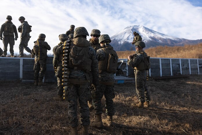 U.S. Marines prepare for a Mark 19 40 mm grenade machine gun range during Artillery Relocation Training Program 23.3 in the North Fuji Maneuver Area at Combined Arms Training Center Camp Fuji, Japan, Nov. 30, 2023. The skills developed at ARTP increase the proficiency and readiness of the only permanently forward-deployed artillery unit in the Marine Corps, enabling them to provide indirect fires. The Marines are with Alpha Battery, 3d Battalion, 12th Marine Littoral Regiment, 3d Marine Division. (U.S. Marine Corps photo by Sgt. Alyssa Chuluda)