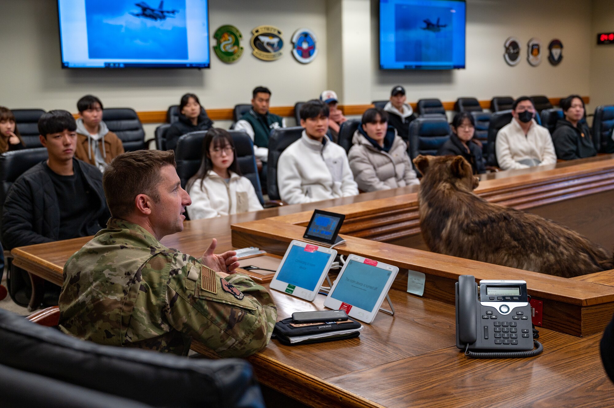 Col. Jeffrey D. Shulman speaks to Kunsan National University students during a base tour at Kunsan Air Base.