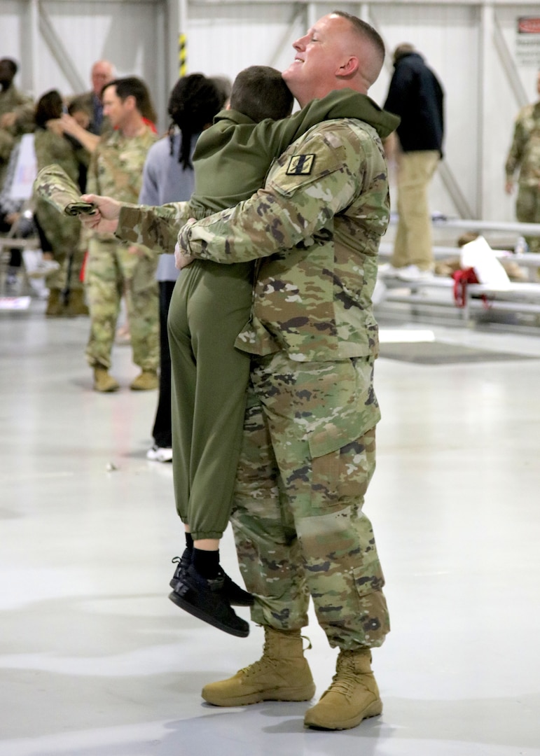 Soldiers of the Georgia National Guard’s 201st Regional Support Group are reunited with family members during a welcome home ceremony at the Clay National Guard Center in Marietta, Ga., Dec. 1, 2023. The Soldiers returned from a 10-month deployment to Europe.