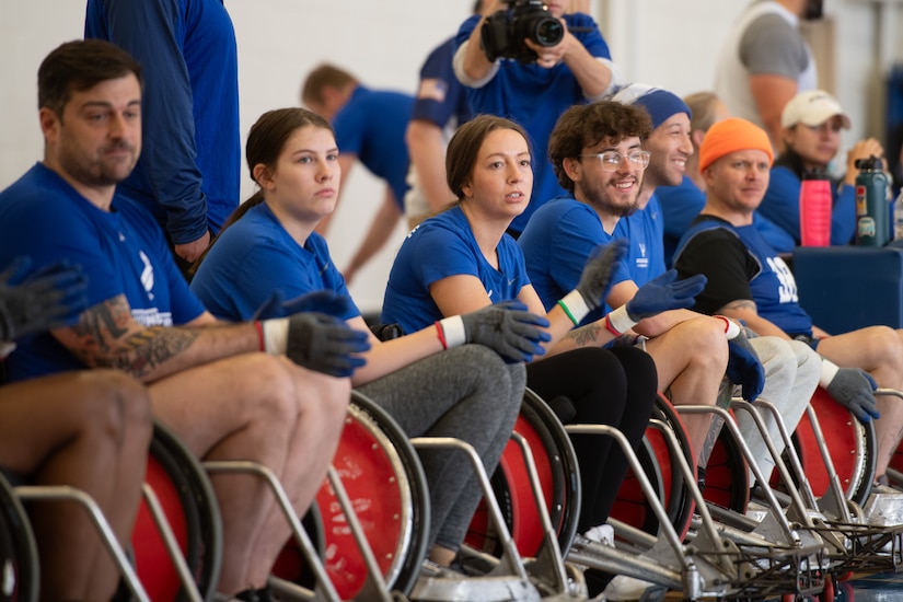 U.S. Air Force Wounded Warrior athletes and volunteers applaud before playing wheelchair rugby at Joint Base Andrews
