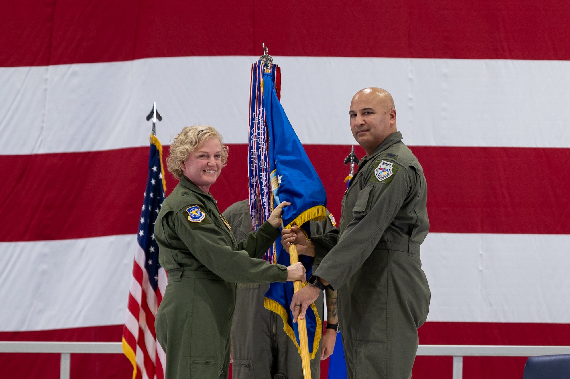 U.S. Air Force Col. Jeffrey A. Smith assumes command of the 932nd Airlift Wing during the assumption of command ceremony, Dec. 1, 2023, at Scott Air Force Base, Illinois. The assumption of command ceremony is a military tradition recognizing the formal exchange of command from one officer to another. (U.S. Air Force photo by Tech. Sgt. Kari Siltz)