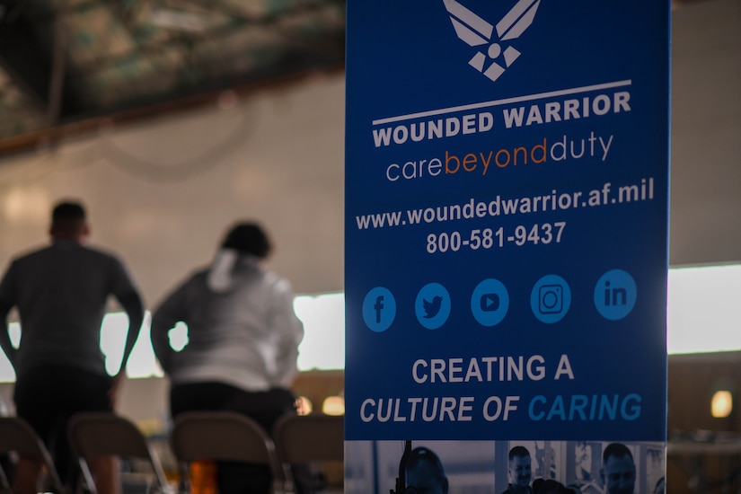 A banner is displayed at the Hangar 14 entrance during the 2023 Warrior CARE Week hosted by the Air Force Wounded Warrior program at Joint Base Andrews