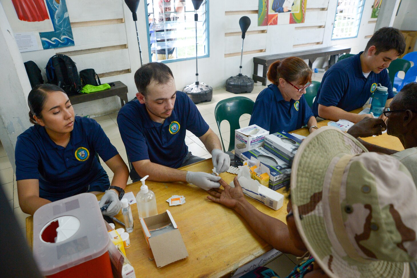 U.S. Navy Sailors provide care to and counsel local residents during a community health engagement at the Holy Cross Cathedral in Honiara, Solomon Islands, as part of Pacific Partnership 2024-1, Dec. 2, 2023. Pacific Partnership, now in its 19th iteration, is the largest multinational humanitarian assistance and disaster relief preparedness mission conducted in the Indo-Pacific and works to enhance regional interoperability and disaster response capabilities, increase security stability in the region, and foster new and enduring friendships. (U.S. Navy photo by Mass Communication Specialist 2nd Class Jacob Woitzel)