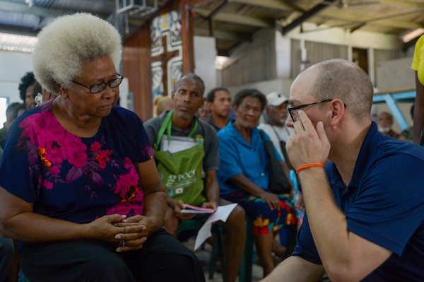 U.S. Navy Hospital Corpsman 2nd Class Dzmitry Astapchyk, from Toms River, New Jersey, helps a patient choose an eyeglass prescription during a community health engagement at the Holy Cross Cathedral in Honiara, Solomon Islands, as part of Pacific Partnership 2024-1, Dec. 2, 2023. Pacific Partnership, now in its 19th iteration, is the largest multinational humanitarian assistance and disaster relief preparedness mission conducted in the Indo-Pacific and works to enhance regional interoperability and disaster response capabilities, increase security stability in the region, and foster new and enduring friendships. (U.S. Navy photo by Mass Communication Specialist 2nd Class Jacob Woitzel)