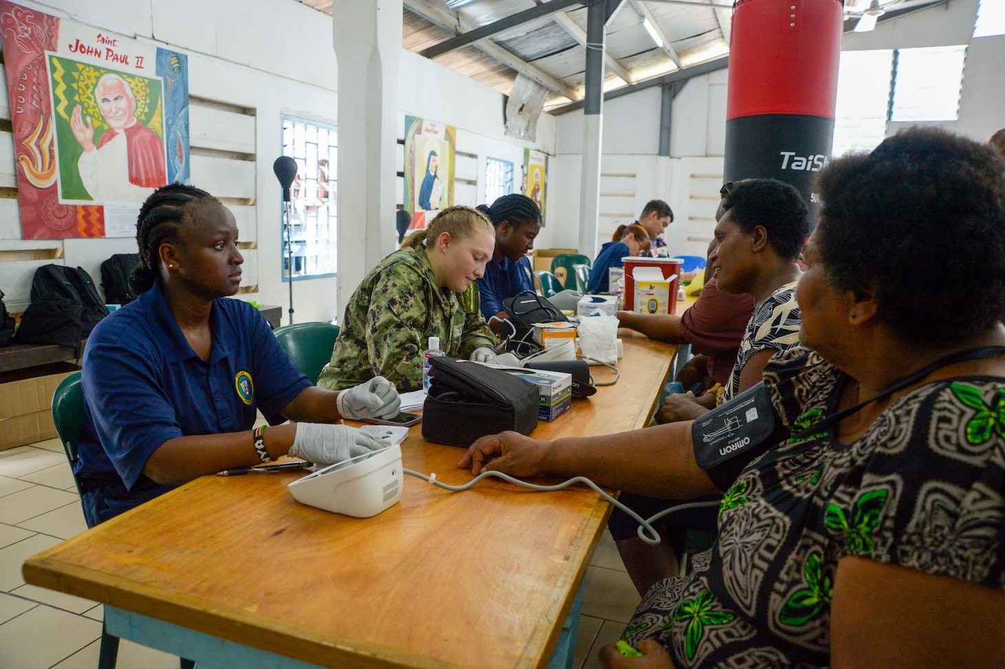 U.S. Navy Sailors provide care to local residents during a community health engagement at the Holy Cross Cathedral in Honiara, Solomon Islands, as part of Pacific Partnership 2024-1, Dec. 2, 2023. Pacific Partnership, now in its 19th iteration, is the largest multinational humanitarian assistance and disaster relief preparedness mission conducted in the Indo-Pacific and works to enhance regional interoperability and disaster response capabilities, increase security stability in the region, and foster new and enduring friendships. (U.S. Navy photo by Mass Communication Specialist 2nd Class Jacob Woitzel)