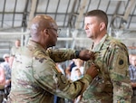 Major Gen. Rodney Boyd, the Assistant Adjutant General – Army of the Illinois National Guard and the Commander of the Illinois Army National Guard, presents Col. Jason Osberg with the Legion of Merit at the Army Aviation Support Facility in Peoria, Illinois.