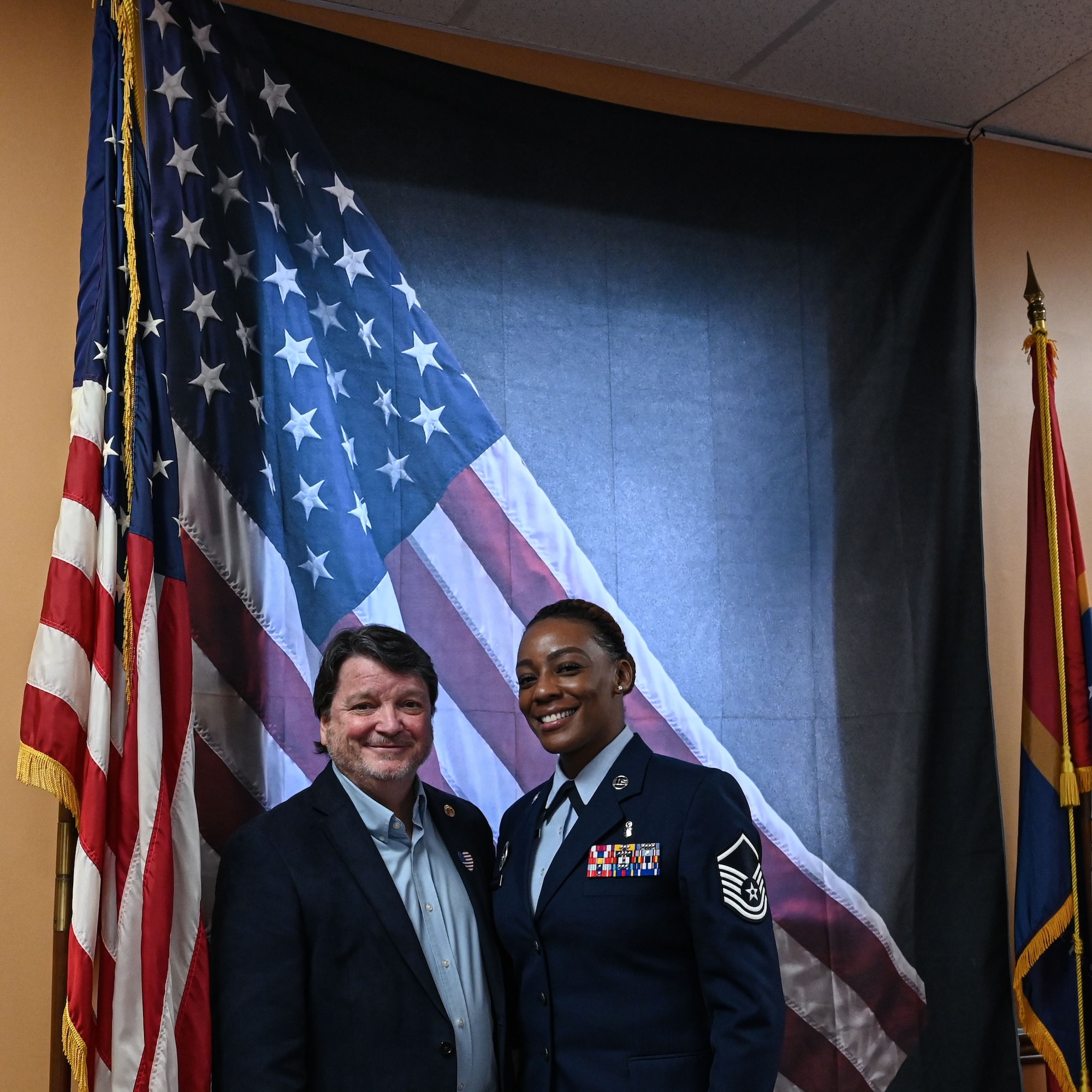 Mayor of Columbus MS. and MSgt Washington pose for a photo.