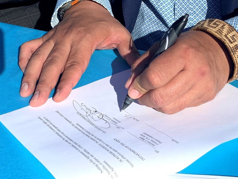 Gila River Indian Community Governor Stephen Roe Lewis signs a project partnership agreement to begin construction on phase I of the Pima-Maricopa Irrigation Project Renewal Energy Pilot Project Nov. 9 at the Gila River Indian Reservation in Arizona. The agreement starts the first phase of the solar-over-canal project within the Community and will involve construction of solar panels over a portion of the Community’s canal.