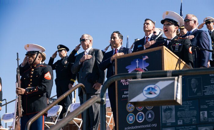 Retired U.S. Marine Sgt. Rocio Sanchez sings the Star-Spangled Banner during the annual Mt. Soledad Veteran’s Day Ceremony, La Jolla, California, Nov. 11, 2023. This year’s ceremony commemorated the 50th anniversary of the Vietnam War. The Mt. Soledad National Veterans Memorial is an official partner of the United States of America Vietnam War Commemoration, which was launched by President Barack Obama in 2012. The commemoration was authorized by Congress to commemorate the 50th anniversary of the Vietnam War. This commemoration effort has been continued under Presidential proclamations by both President Donald Trump and President Joseph Biden. (U.S. Marine Corps photo by Staff Sgt. Melissa L. Karnath)