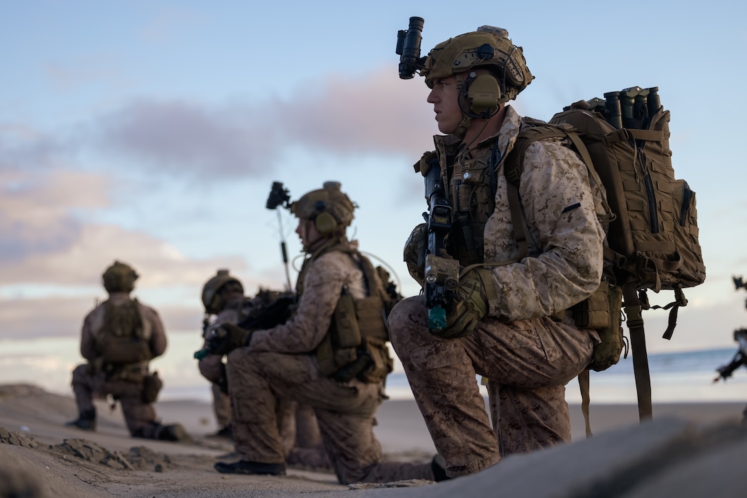 U.S. Marines with Charlie Company, 1st Reconnaissance Battalion, 1st Marine Division, post security after coming ashore during a raid as part of Exercise Steel Knight 23.2 at Marine Corps Base Camp Pendleton, California, Nov. 30, 2023. Steel Knight is a three-phase exercise designed to train I Marine Expeditionary Force in the planning, deployment and command and control of a joint force against a peer or near-peer adversary combat force and enhance existing live-fire and maneuver capabilities of the Marine Air-Ground Task Force. (U.S. Marine Corps photo by Cpl. Daniel)