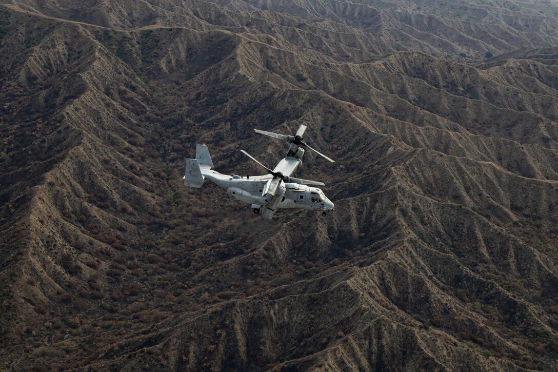 A U.S. Marine Corps MV-22B Osprey with Marine Medium Tiltrotor Squadron (VMM) 164, Marine Aircraft Group 39, 3rd Marine Aircraft Wing, flies during embassy reinforcement training in support of Exercise Steel Knight 23.2 at Marine Corps Base Camp Pendleton, California, Nov. 29, 2023.   Marines and aircraft with MAG-39 conducted aerial  support for embassy reinforcement training with Marine Rotational Force- Darwin. Steel Knight 23.2 is a three-phase exercise designed to train I Marine Expeditionary Force in the planning, deployment and command and control of a joint force against a peer or near-peer adversary combat force and enhance existing live-fire and maneuver capabilities of the Marine Air- Ground Task Force. (U.S. Marine Corps photo by Sgt Potter)
