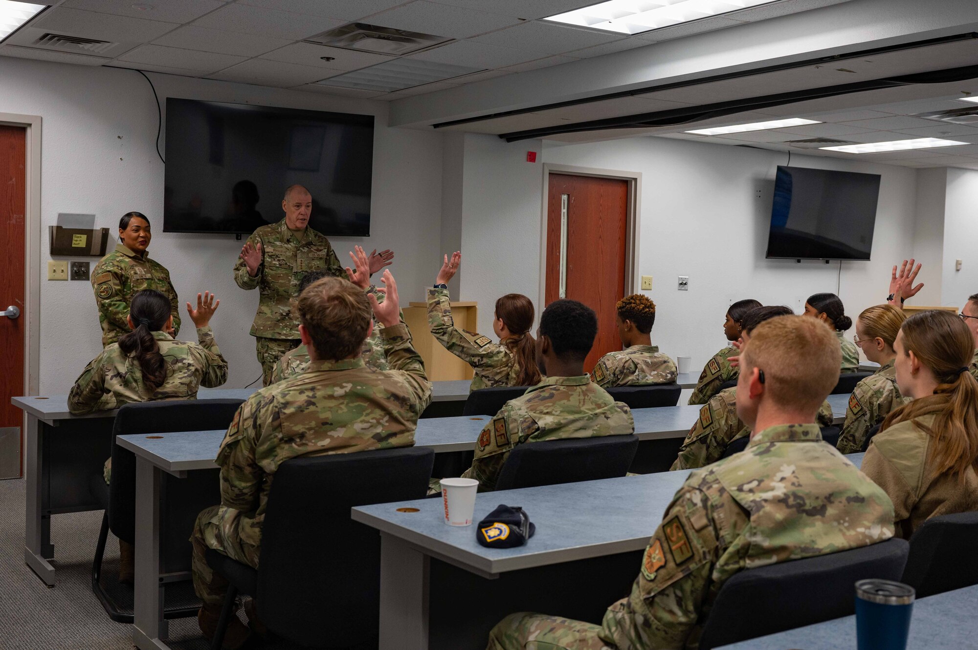 Air Force Global Strike Command leaders talk to security forces Airmen.
