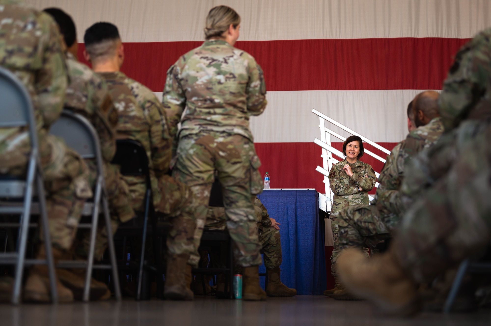 Chief Master Sgt. of the Air Force Joanne Bass speaks with an Airman from the 607th Air Control Squadron during a base all-call.