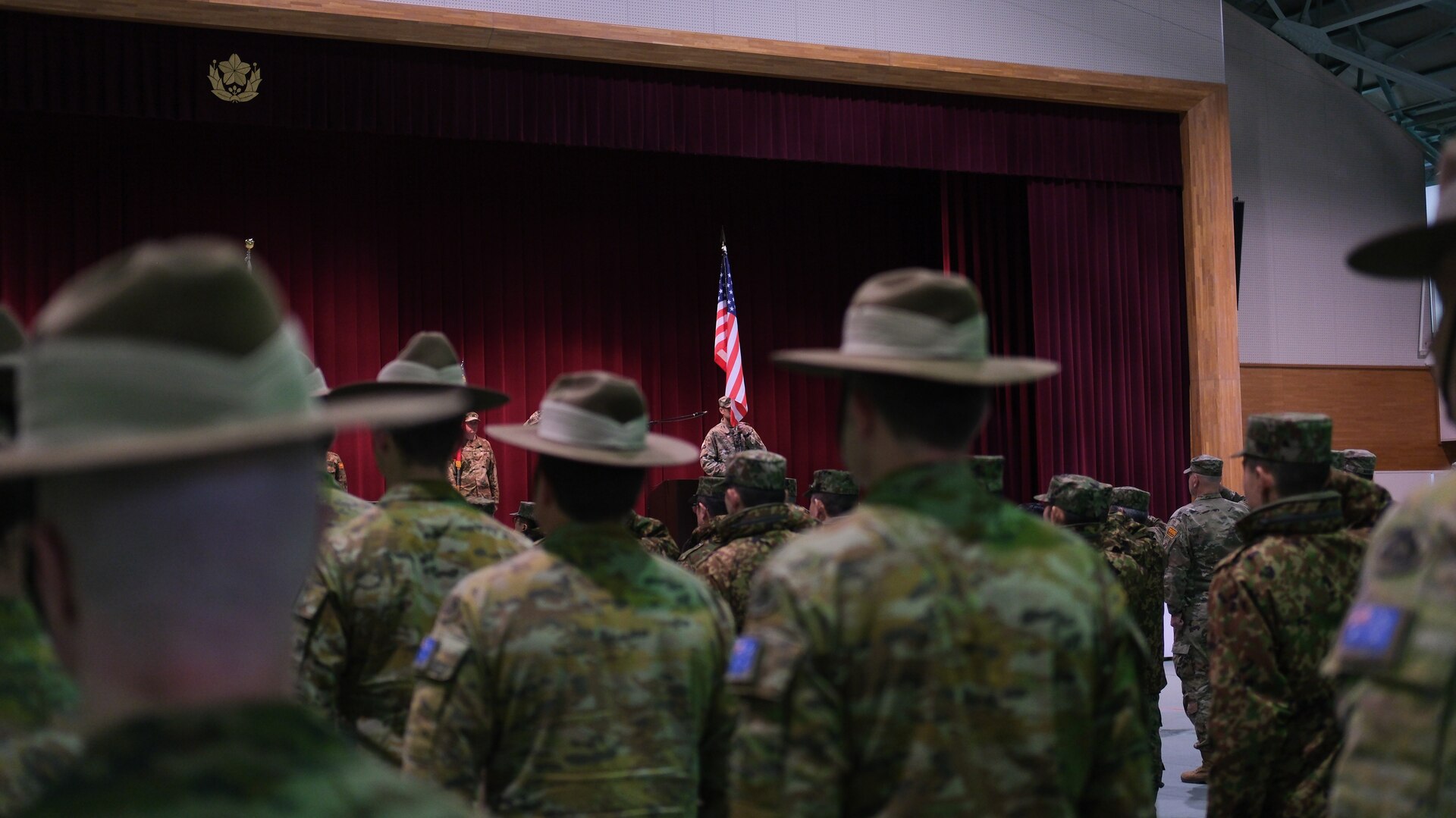 Members of the Japan Ground Self-Defense Force and soldiers from the U.S. Army's 11th Airborne Division, salute during the opening ceremony of Yama Sakura 85 on Camp Higashi-Chitose, Japan, Dec. 3, 2023. YS 85 is a trilateral command post exercise featuring U.S. soldiers, members of the JGSDF, and soldiers from the Australian Army's 1st Division, and demonstrates the strength of the relationship between the three countries and their commitment to a free and open Indo-Pacific.