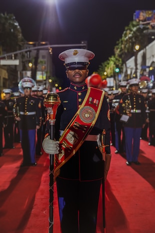 U.S. Marines assigned to Marine Band San Diego, stand at attention during the Hollywood Christmas Parade, in Hollywood, California, Nov. 26, 2023. Marine Band San Diego participated in the parade to improve community relations, increase morale, and demonstrate holiday spirit. (U.S. Marine Corps photo by Lance Cpl. Francisco Angel)
