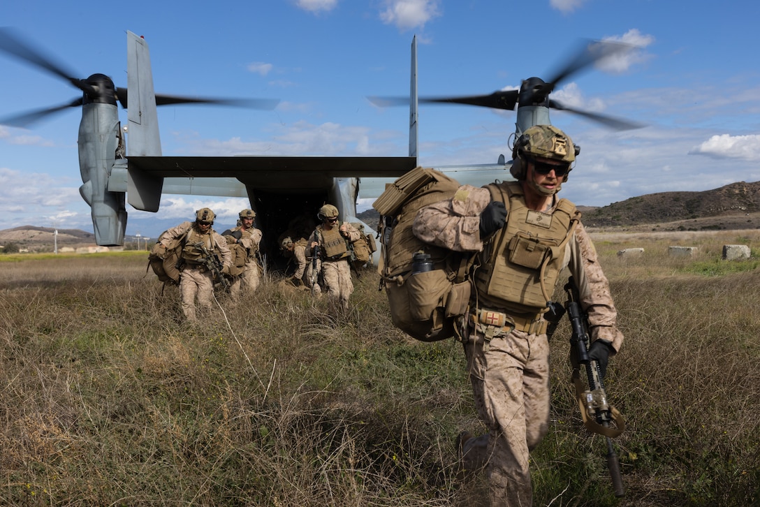 U.S. Marines with Fox Company, 2nd Battalion, 5th Marine Regiment, 1st Marine Division, unload from an MV-22B Osprey assigned to Marine Medium Tiltrotor Squadron (VMM) 164, Marine Aircraft Group 39, 3rd Marine Aircraft Wing, for a simulated embassy reinforcement during a mission rehearsal exercise as part of Exercise Steel Knight 23.2 at Marine Corps Base Camp Pendleton, California, Nov. 29, 2023. Steel Knight maintains and sharpens I Marine Expeditionary Force as America’s expeditionary force in readiness – organized, trained and equipped to respond to any crisis, anytime, anywhere. This exercise will certify 5th Marines to be forward-postured in Australia as Marine Rotational Force - Darwin, a six-month deployment during which Marines train with Australian allies and facilitate rapid response to crises and contingencies. (U.S. Marine Corps photo by Cpl. Earik Barton)