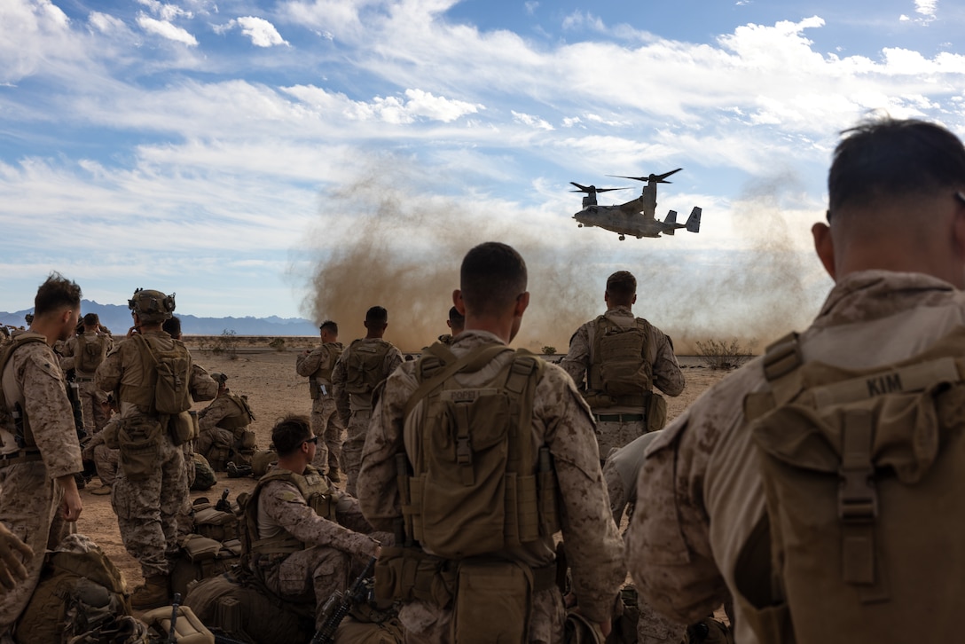 U.S. Marines with Fox Company, 2nd Battalion, 5th Marine Regiment, 1st Marine Division, prepare to board an MV-22B Osprey assigned to Marine Medium Tiltrotor Squadron (VMM) 164, Marine Aircraft Group 39, 3rd Marine Aircraft Wing, for a simulated embassy reinforcement during a mission rehearsal exercise as part of Exercise Steel Knight 23.2 at Marine Corps Air Station Yuma, Arizona, Nov. 29, 2023. Steel Knight maintains and sharpens I Marine Expeditionary Force as America’s expeditionary force in readiness – organized, trained and equipped to respond to any crisis, anytime, anywhere. This exercise will certify 5th Marines to be forward-postured in Australia as Marine Rotational Force - Darwin, a six-month deployment during which Marines train with Australian allies and facilitate rapid response to crises and contingencies. (U.S. Marine Corps photo by Cpl. Earik Barton)