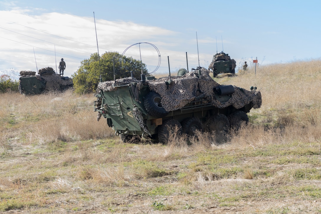 U.S. Marines with 1st Light Armored Reconnaissance Battalion, 1st Marine Division, provide security in Light Armored Vehicles at an evacuation control center during a mission rehearsal exercise as part of Exercise Steel Knight 23.2 at Marine Corps Base Camp Pendleton, California, Dec. 1, 2023. Steel Knight maintains and sharpens I Marine Expeditionary Force as America’s expeditionary force in readiness – organized, trained and equipped to respond to any crisis, anytime, anywhere. (U.S. Marine Corps photo by Sgt. Cristian Bestul)