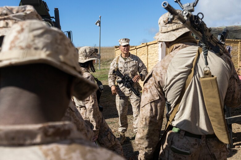 U.S. Marine Corps Maj. Nelson Lovos, the operations officer with Combat Logistics Battalion 5, Combat Logistics Regiment 1, 1st Marine Logistics Group, briefs Marines before establishing a simulated evacuation control center during a mission rehearsal exercise as part of Exercise Steel Knight 23.2 at Marine Corps Base Camp Pendleton, California, Nov. 30, 2023. Steel Knight maintains and sharpens I Marine Expeditionary Force as America’s expeditionary force in readiness – organized, trained and equipped to respond to any crisis, anytime, anywhere. This exercise will certify the battalion and 5th Marine Regiment, 1st Marine Division, to be forward-postured in Australia as Marine Rotational Force - Darwin, a six-month deployment during which Marines train with Australian allies and facilitate rapid response to crises and contingencies. (U.S. Marine Corps photo by Sgt. Cristian Bestul)