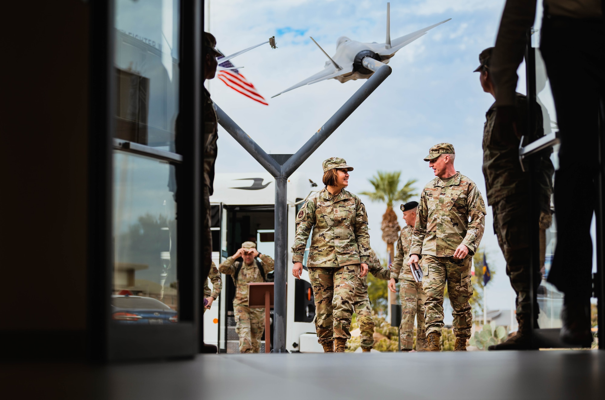 Chief Master Sgt. of the Air Force Joanne Bass (left), speaks with Brig. Gen. Jason Rueschhoff, 56th Fighter Wing commander (right), upon arrival to the 56th FW.