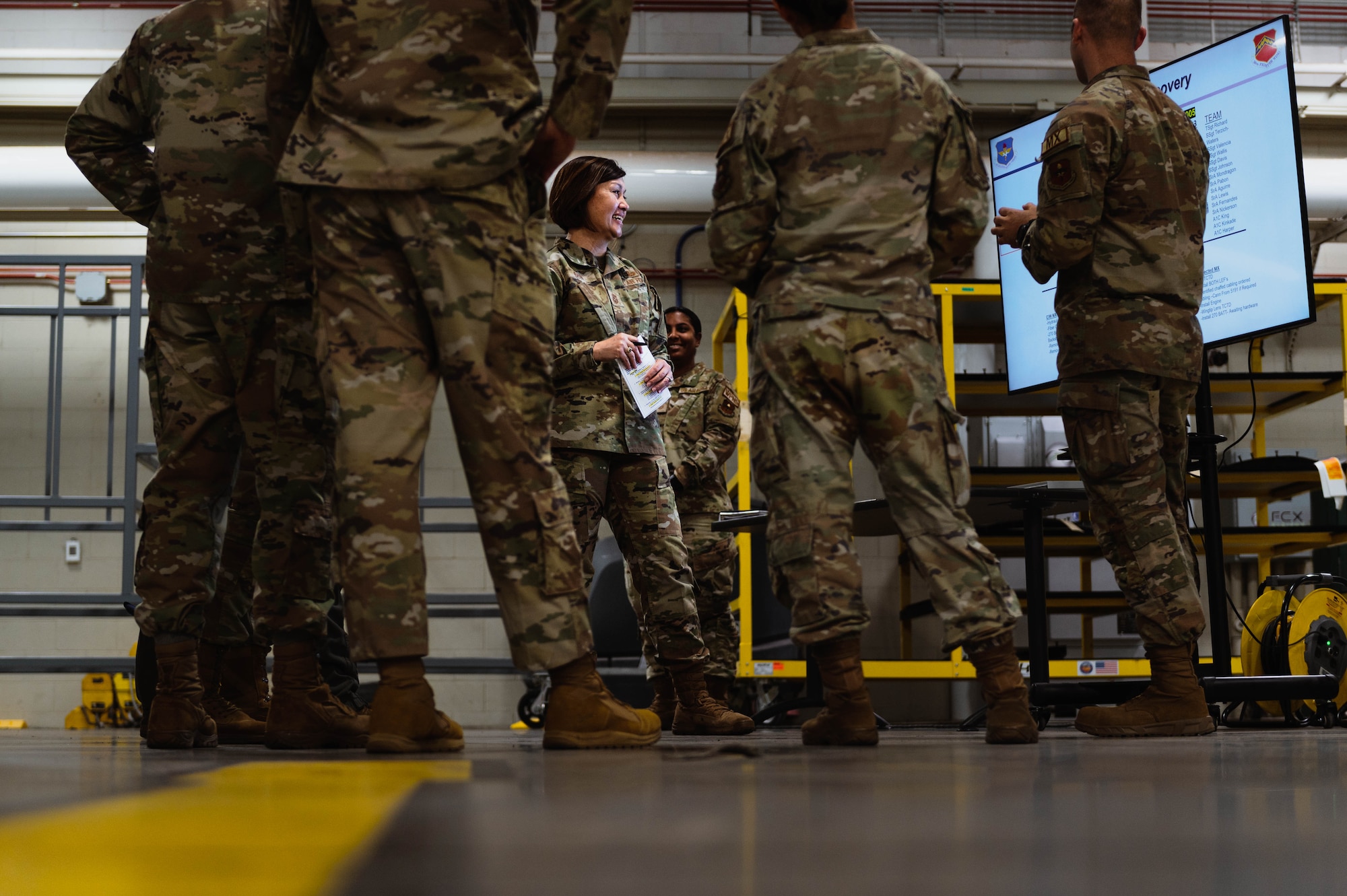 Chief Master Sgt. of the Air Force Joanne Bass engages with Airmen at the 308th Aircraft Maintenance Unit.