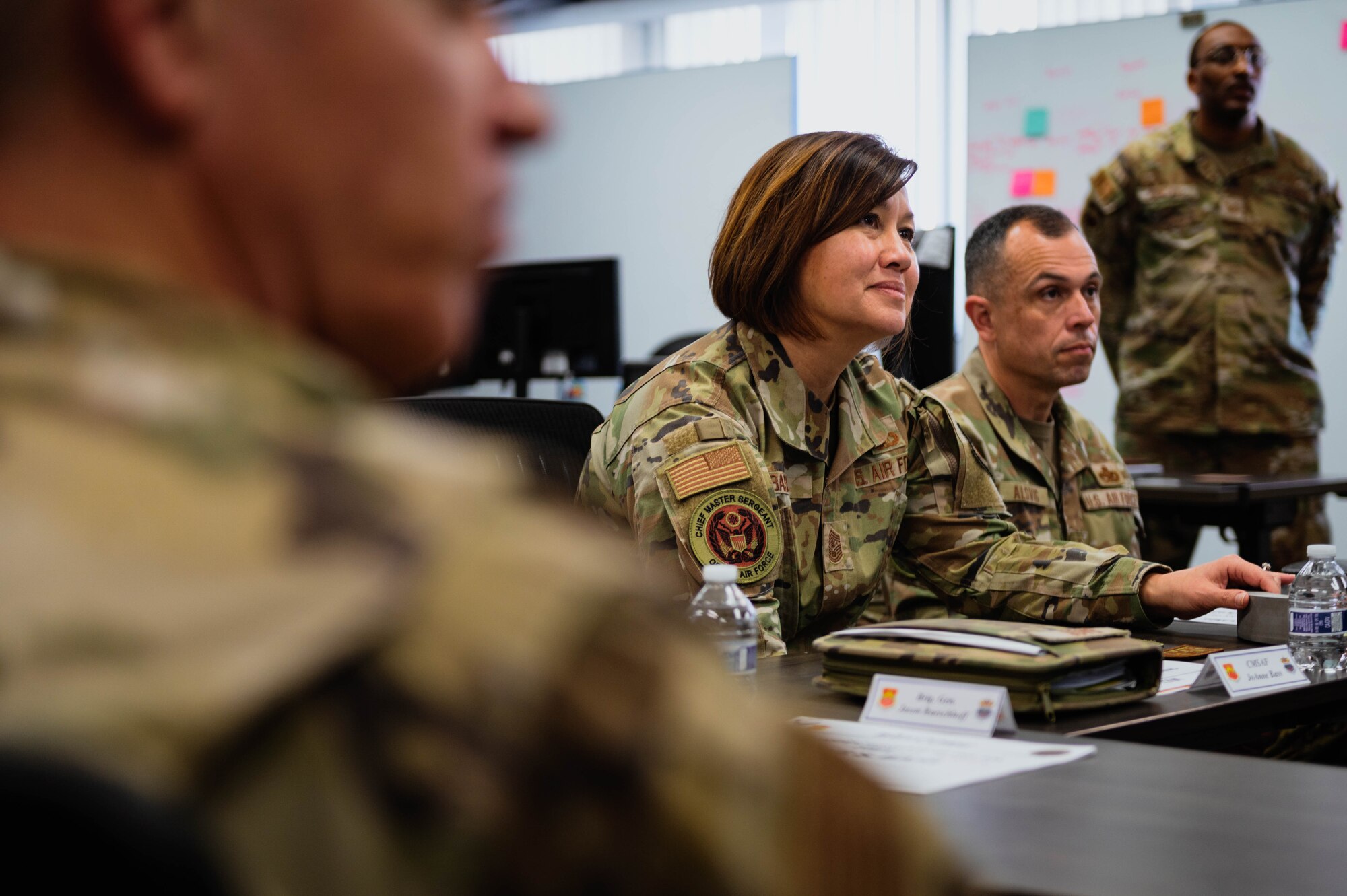 Chief Master Sgt. of the Air Force Joanne Bass engages with Luke Air Force Spark cells innovation team Airmen.