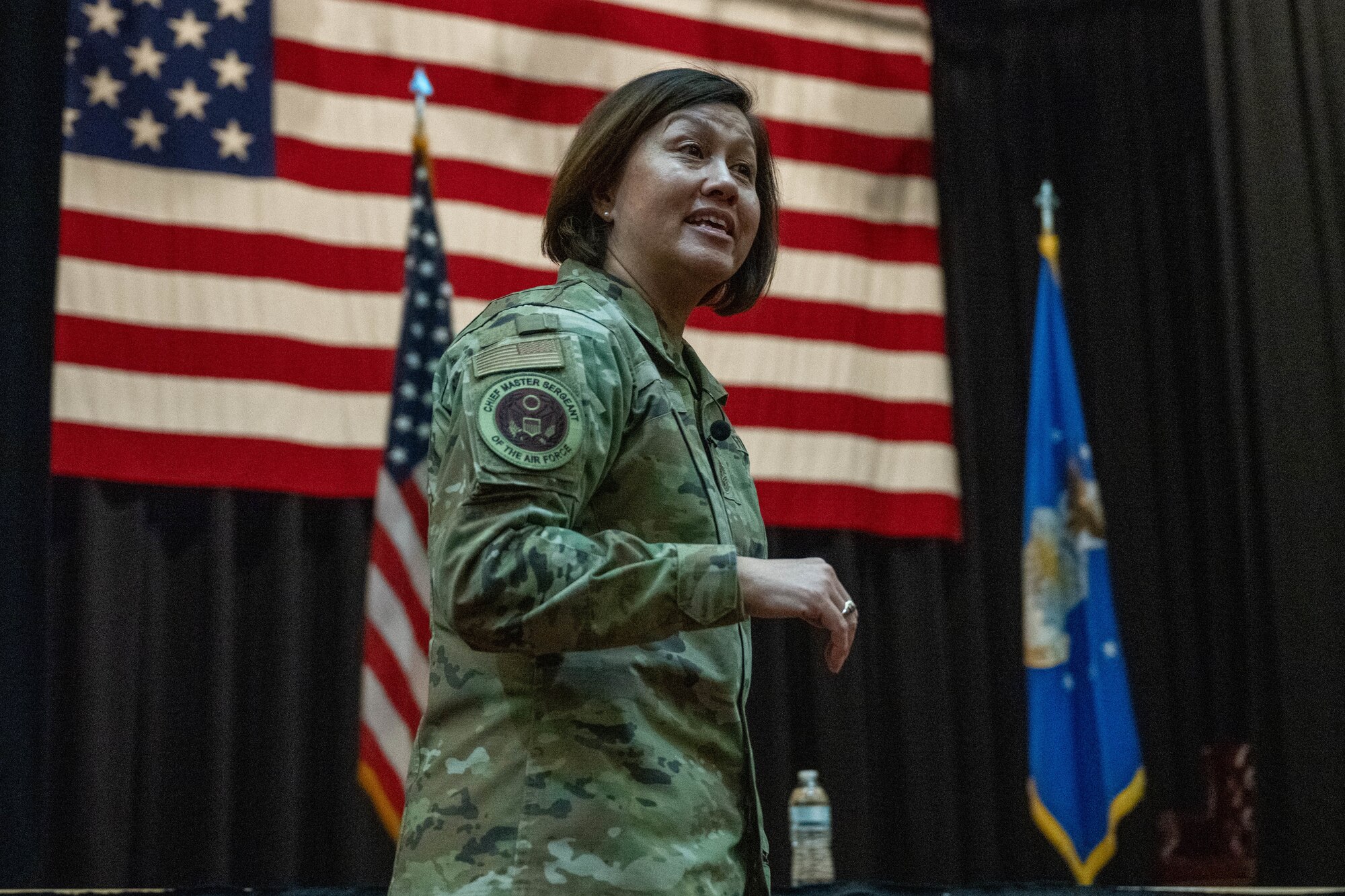 Chief Master Sgt. of the Air Force JoAnne S. Bass speaks at an all-call Nov. 29, 2023, at McConnell Air Force Base, Kansas. Bass discussed the future for the Air Force and addressed Team McConnell’s questions and concerns. (U.S. Air Force photo by Airman 1st Class Felicia Przydzial)