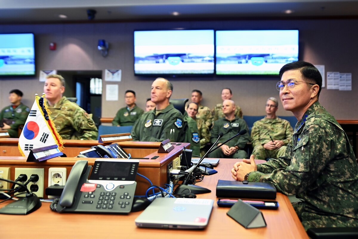 Republic of Korea Air Force Chief of Staff, Gen. Lee, Young Su, right, listens to a briefing in the 607th Air Operations Center at Osan Air Base, ROK, Dec. 4, 2023.