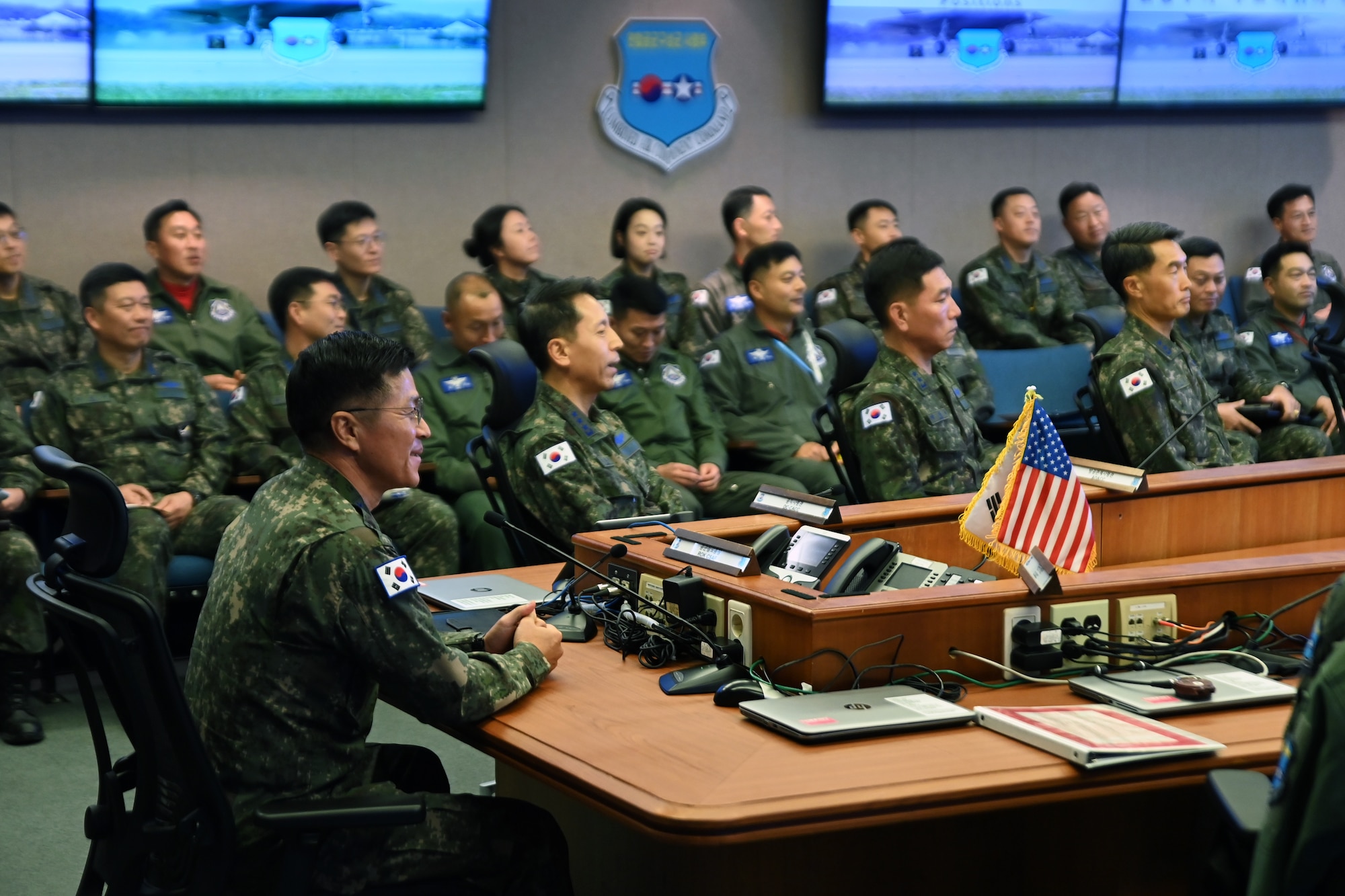 Republic of Korea Air Force Chief of Staff, Gen. Lee, Young Su, left, listens to a briefing in the 607th Air Operations Center at Osan Air Base, ROK, Dec. 4, 2023.