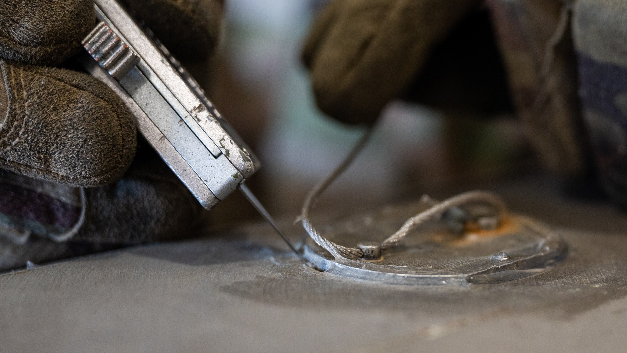 Airman 1st Class Khaliq Gilmore, 8th Maintenance Squadron conventional maintenance crew technician, performs routine deconstruction of a guided bomb unit-31 version 3