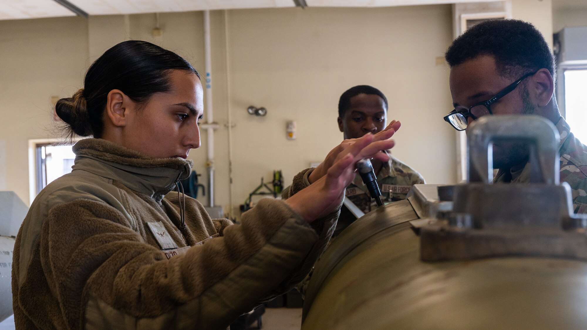 Airman Alexis Rizo, 8th Maintenance Squadron conventional maintenance technician, unscrews a bolt while deconstructing a guided bomb unit-31 version 3