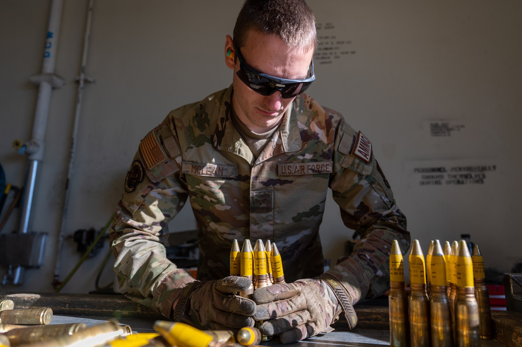 Senior Airman Brandon Mclean, 8th Maintenance Squadron conventional maintenance crew chief, sorts through 20 mm rounds