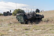 U.S. Marines with 1st Light Armored Reconnaissance Battalion, 1st Marine Division, provide security in Light Armored Vehicles at an evacuation control center during a mission rehearsal exercise as part of Exercise Steel Knight 23.2 at Marine Corps Base Camp Pendleton, California, Dec. 1, 2023. Steel Knight maintains and sharpens I Marine Expeditionary Force as America’s expeditionary force in readiness – organized, trained and equipped to respond to any crisis, anytime, anywhere. (U.S. Marine Corps photo by Sgt. Cristian Bestul)