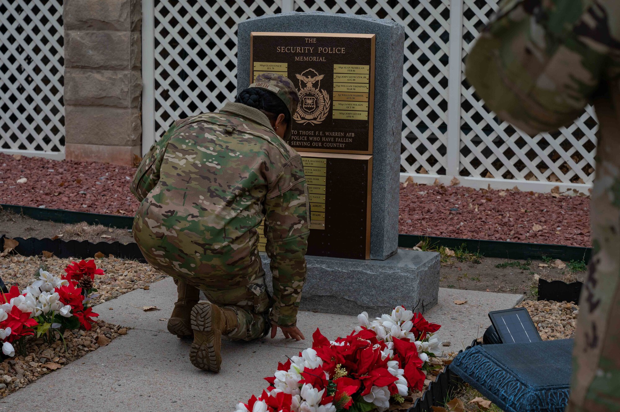 Air Force Global Strike Command, command chief pays respects at a security forces memorial.