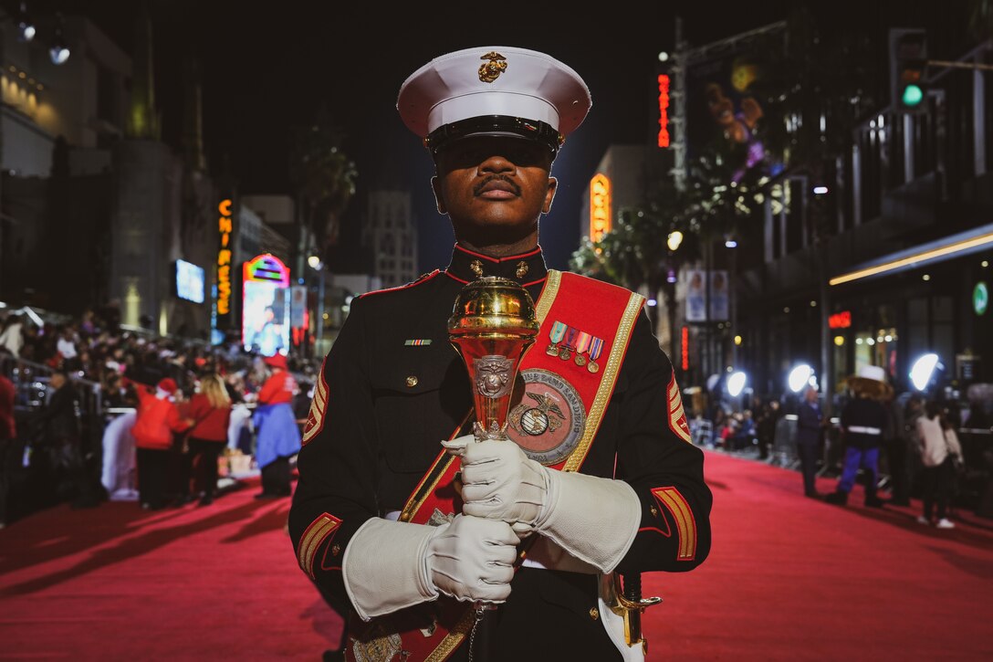 U.S. Marine Corps Staff Sgt. Adam Chandler, drum major with Marine Band San Diego, participates in the Hollywood Christmas Parade, in Hollywood, California, Nov. 26, 2023. Marine Band San Diego participated in the parade to improve community relations, increase morale, and demonstrate holiday spirit. (U.S. Marine Corps photo by Lance Cpl. Francisco Angel)