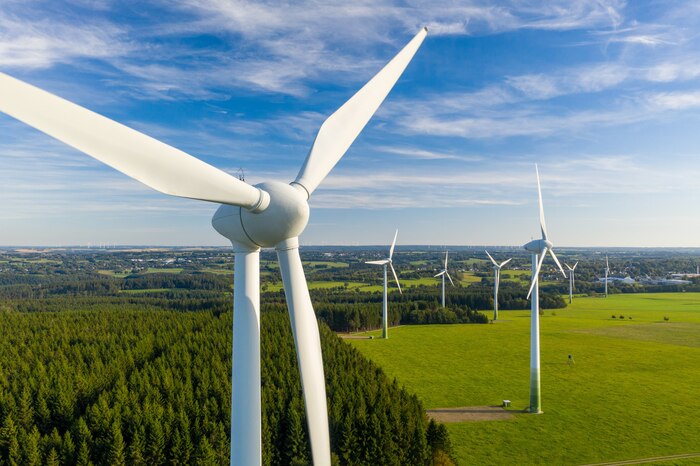 Aerial view of several giant wind turbines [Photo © engel.ac/stock.adobe.com [image is not public domain]