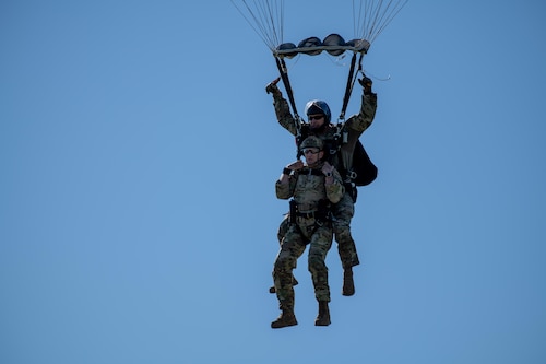 Lt. Gen. John Healy and Senior Master Sgt. Matthew Williams take part in a tandem parachute jump at Patrick Space Force Base, Florida. (Master Sgt. Richard Dunn)