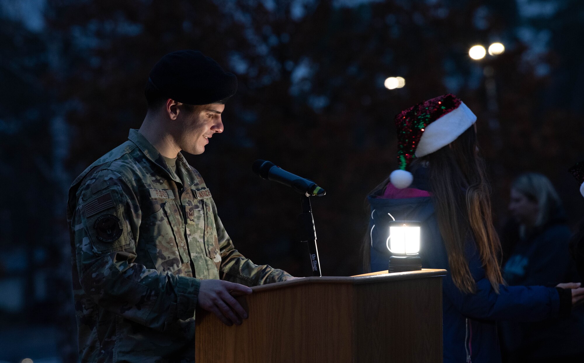 A man speaks at a podium