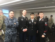 Joe Tincher and Kayla Colfax, center, are pictured when the couple were still in uniform. The former Soldiers married while serving in Korea and continue to serve together as civilian biomedical equipment technicians at the U.S. Army Medical Materiel Agency’s Medical Maintenance Operations Division at Hill Air Force Base, Utah. MMOD-Hill was their last duty station in uniform before transitioning to civilian service in recent years. (Courtesy Kayla Colfax)