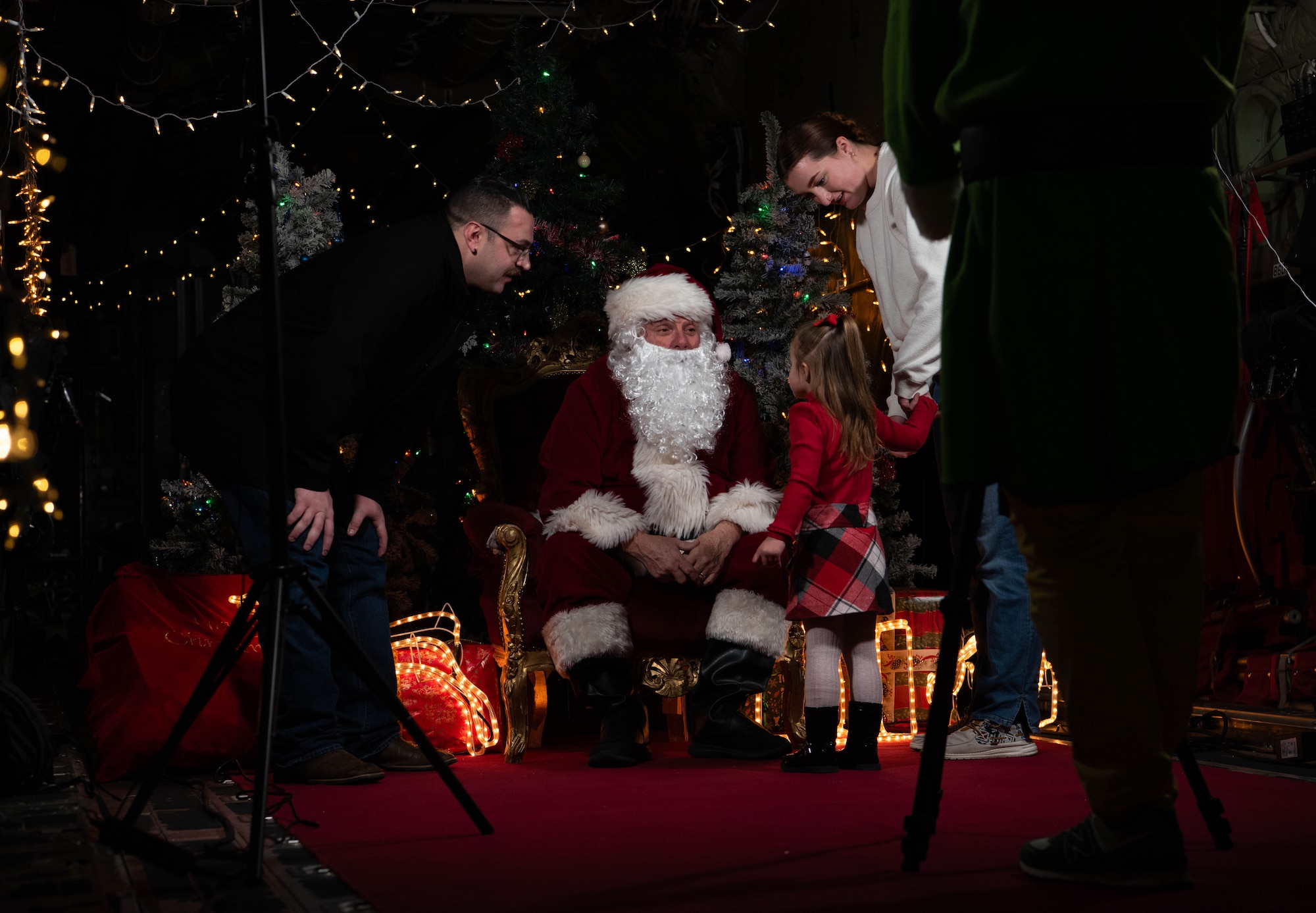 Family talks to Santa Claus.