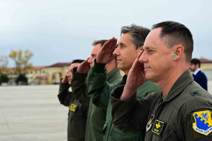 Aviano Air Base leaders salute Secretary of the Air Force Frank Kendall as he departs.