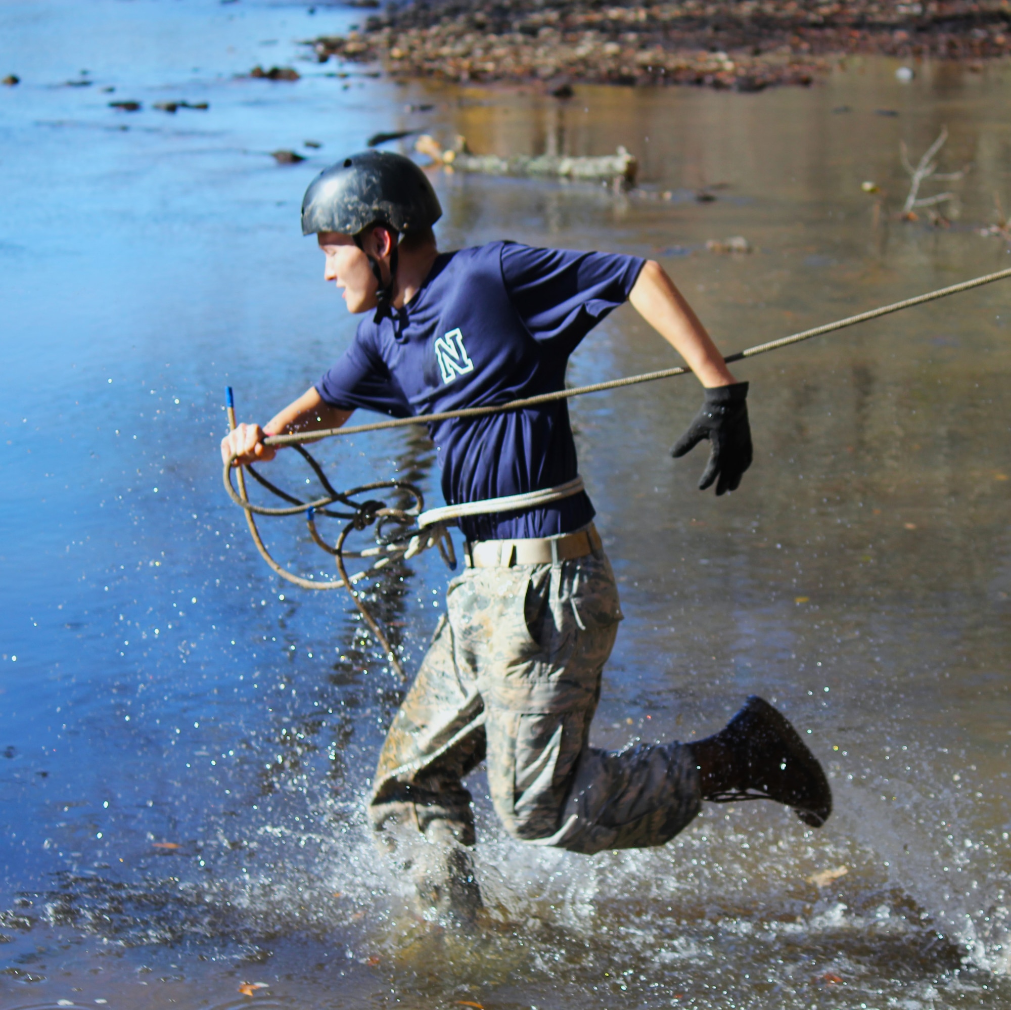 An Air Force Junior ROTC cadet competes in the Rope Bridge event.