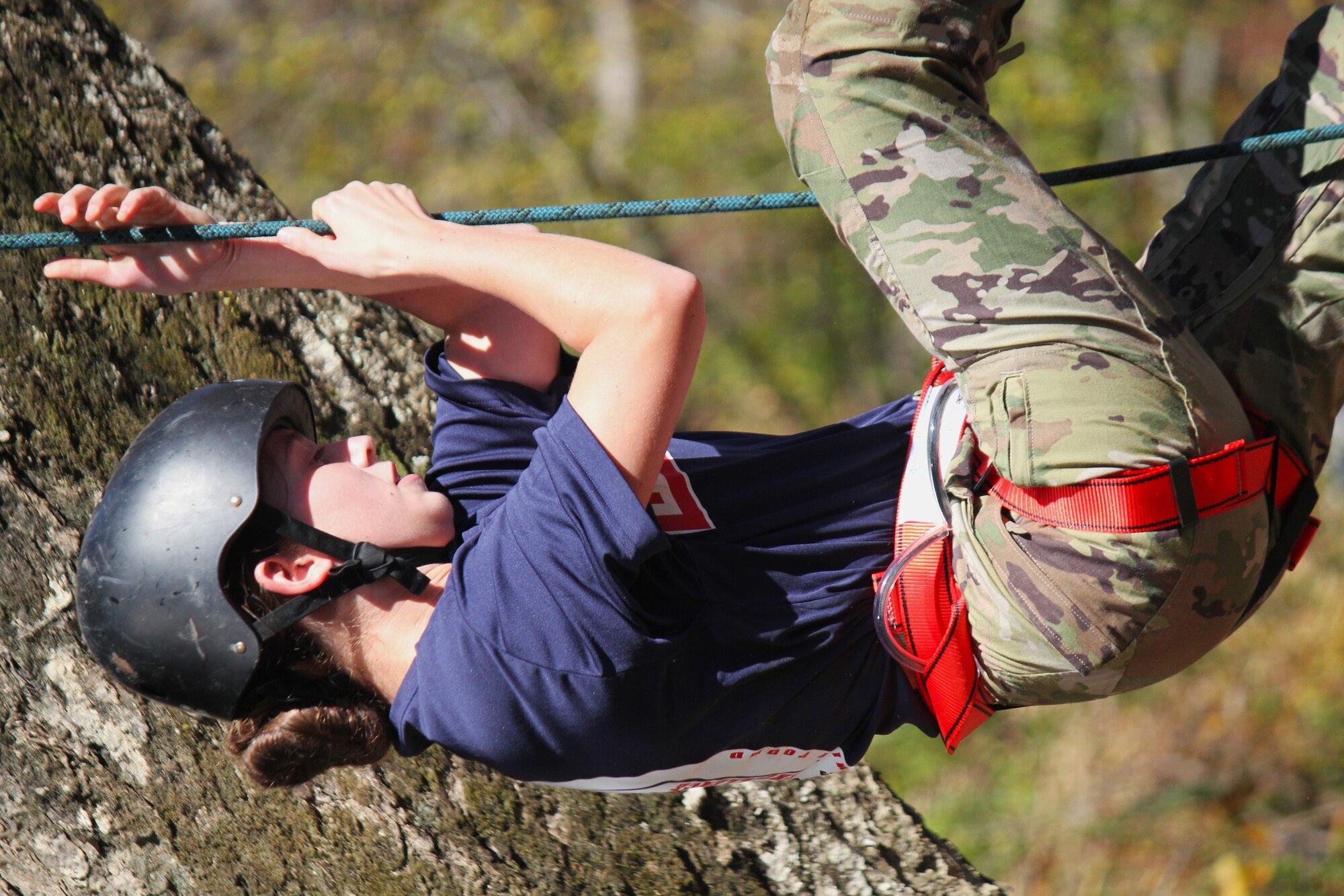 An Air Force Junior ROTC cadet competes in the Rope Bridge event.