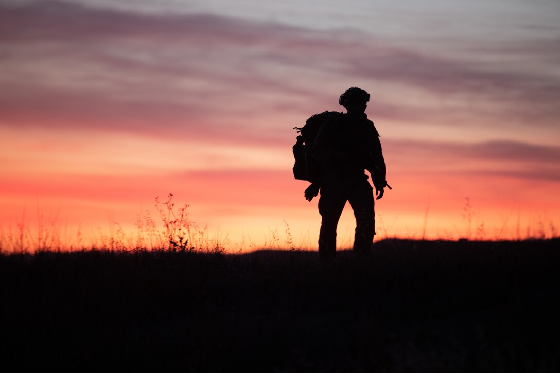 U.S. Marine Corps Cpl. Calub Horton, a team leader with Echo Company, 2nd Battalion, 5th Marine Regiment, 1st Marine Division, patrols during a simulated airfield seizure for a mission rehearsal exercise as part of Exercise Steel Knight 23.2 at Marine Corps Base Camp Pendleton, California, Dec. 2, 2023. Steel Knight maintains and sharpens I Marine Expeditionary Force as America’s expeditionary force in readiness – organized, trained and equipped to respond to any crisis, anytime, anywhere. This exercise will certify 5th Marines to be forward-postured in Australia as Marine Rotational Force - Darwin, a six-month deployment during which Marines train with Australian allies and facilitate rapid response to crises and contingencies. Horton is a native of WaKeeney, Kansas. (U.S. Marine Corps photo by Cpl.  Reynosa)